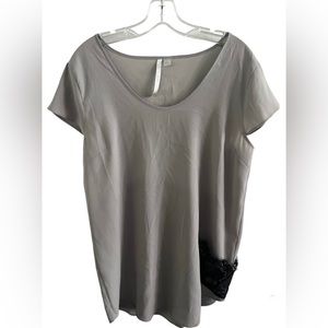 LC Lauren Conrad woman’s Grey blouse. Size large. Lace pocket accent on front.